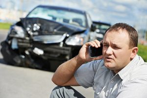 Man contacting a car accident lawyer after being involved in a crash