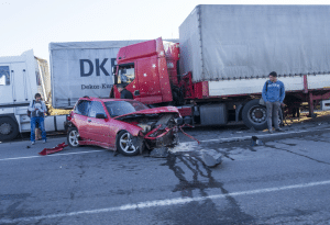 Truck collision with a red car