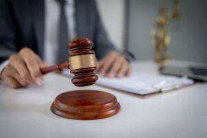 Lawyer working on a documents with gavel in hand