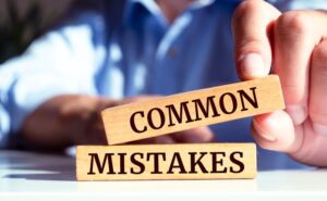 Wooden blocks with words 'Common Mistakes'