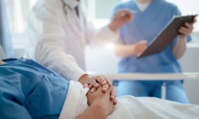 Doctor talking with man patient for monitoring and check up after accident