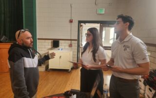 Hurst Limontes attorneys Leyda Castro and Konrad Schmid attending the Holy Spirit Legal and Financial Fair