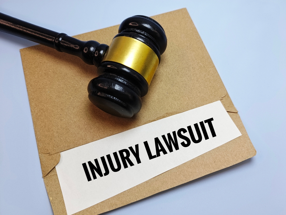 Gavel resting on an injury lawsuit folder symbolizing the steps involved in a personal injury claim
